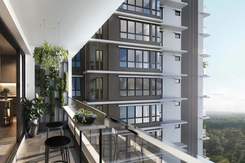 Living room opening onto a planted balcony overlooking another tower and greenery