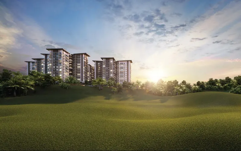Four Rimbun Saujana Residency towers rising behind the Saujana golf course at sunset